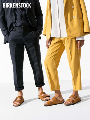 BIRKENSTOCK Arizona double-buckle slippers.