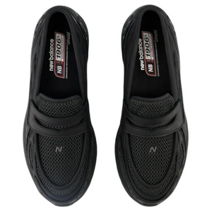 Top-down perspective of the New Balance 1906L Black loafers, clearly showing the cushioned insole and the brand details on the footbed of this exceptional شوز نيو بالانس الأصلي.