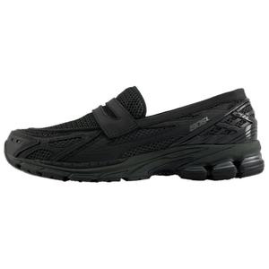 A lateral profile shot of the New Balance 1906L Black, showcasing its sleek mesh and leather upper. This versatile حذاء نيو بالانس combines athletic comfort with loafer style.