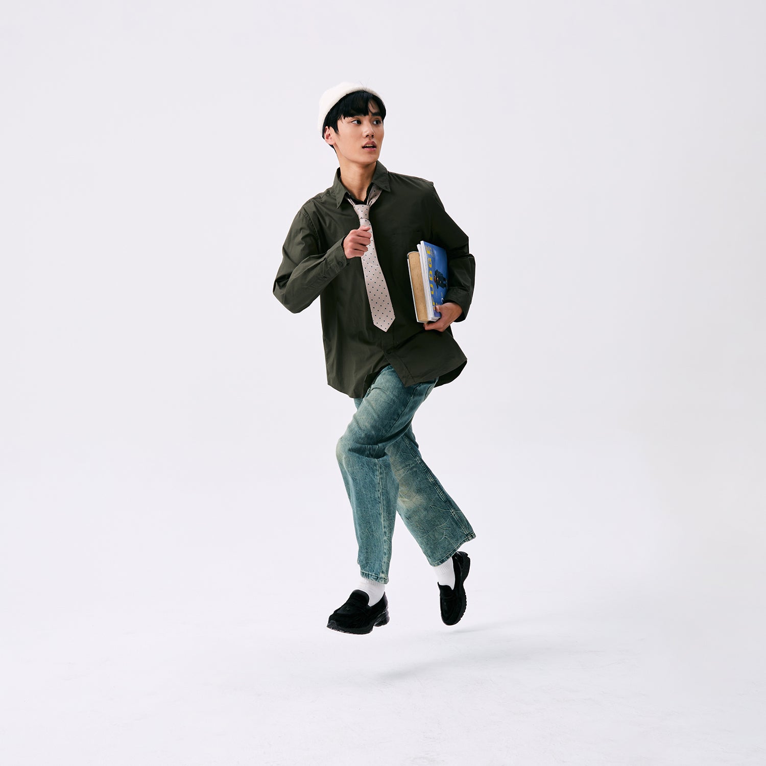 Lifestyle editorial featuring حذاء نيو بالانس styled dynamically with smart-casual attire.